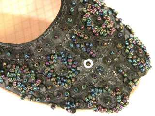 Color  Rich black silk with iridescent beads and black sequins.