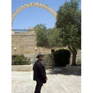 Jewish Man in Traditional Clothes in Front of the Hurva Synagogue Arch 