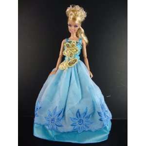  Bright Blue Dress with a Large Gold Sequined Flower on the 