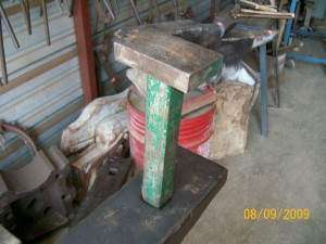   Square Stake. 2 3/4 x 4 inch head. Weight approximately 11 pounds