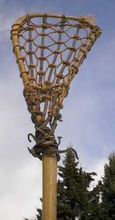  is a vintage wooden lacrosse stick. Measures 46 long. The lacrosse 