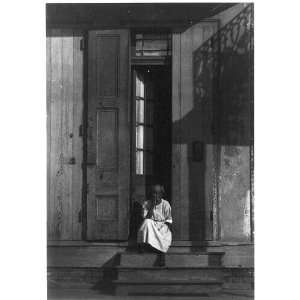  Black woman,wooden doorstep,New Orleans,LA,c1925
