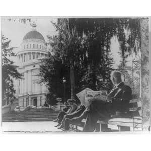 Earl Warren,1891 1974,reading newspaper on park bench,California 